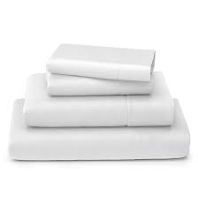 Folded white mattress sheets